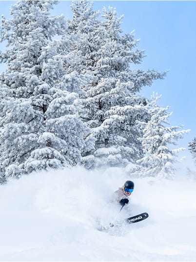person skiing powder