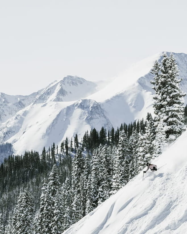skier skiing down mountain