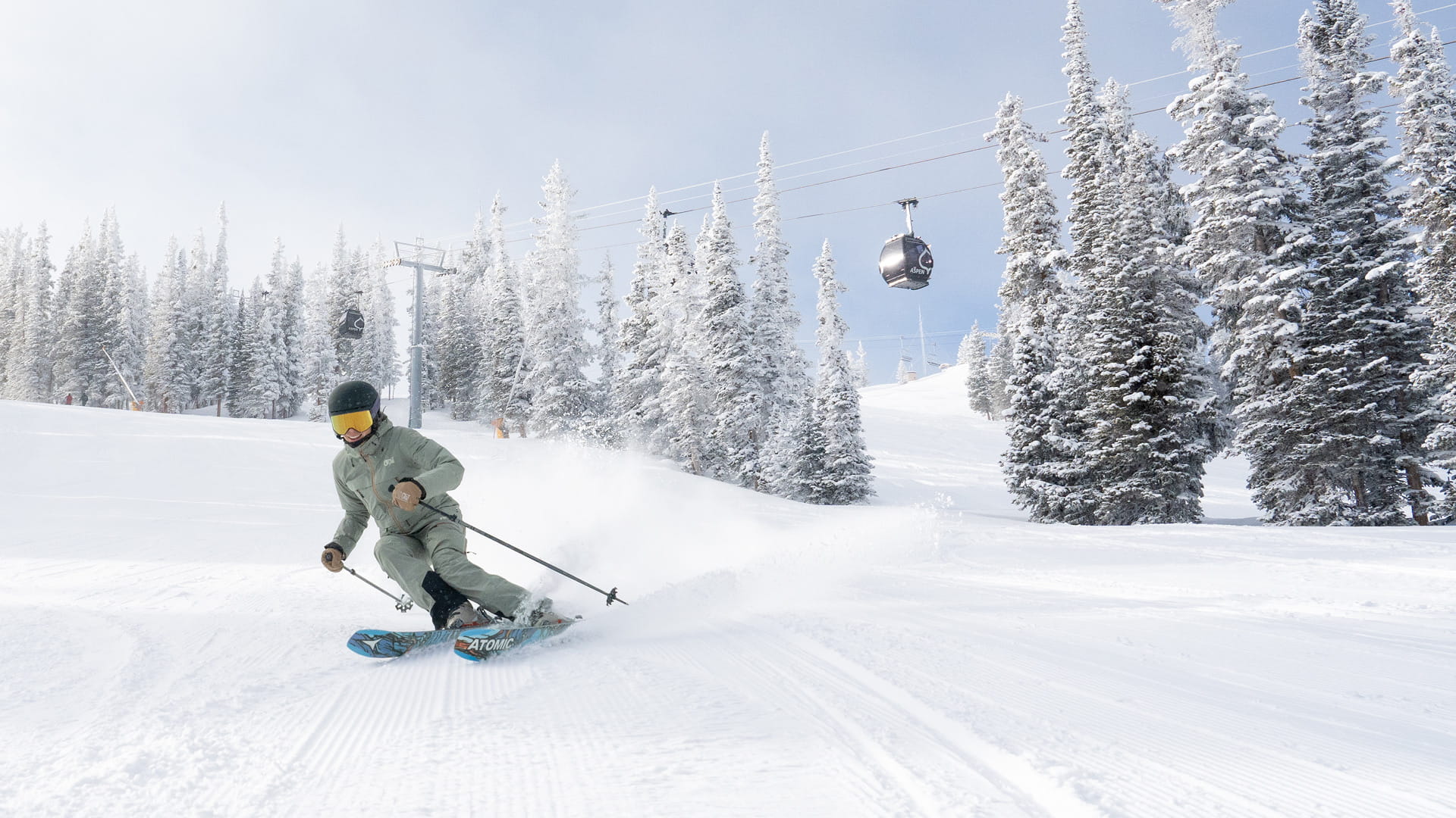 skier skiing down aspen mountain