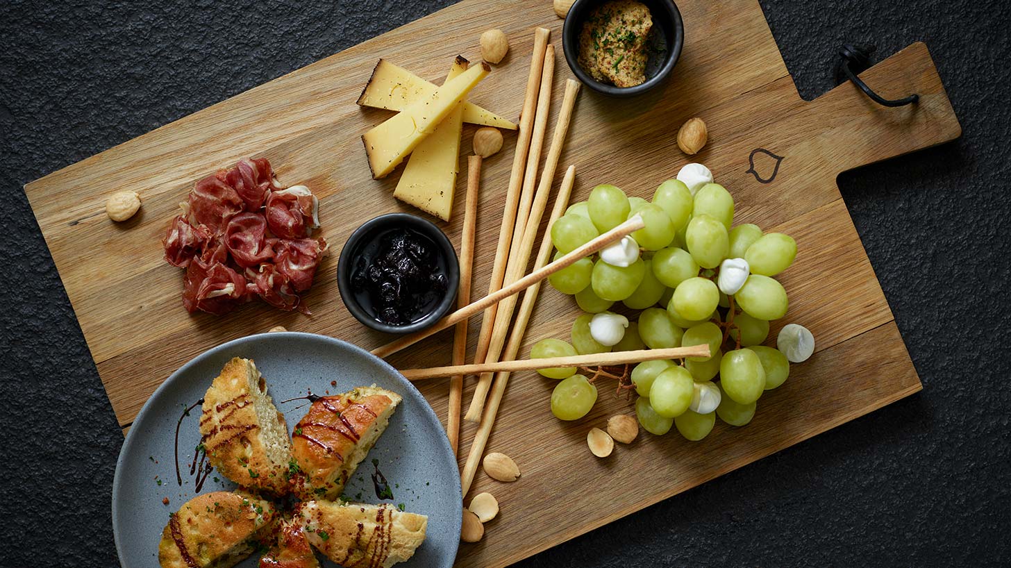 Cheeseboard with grapes and bread