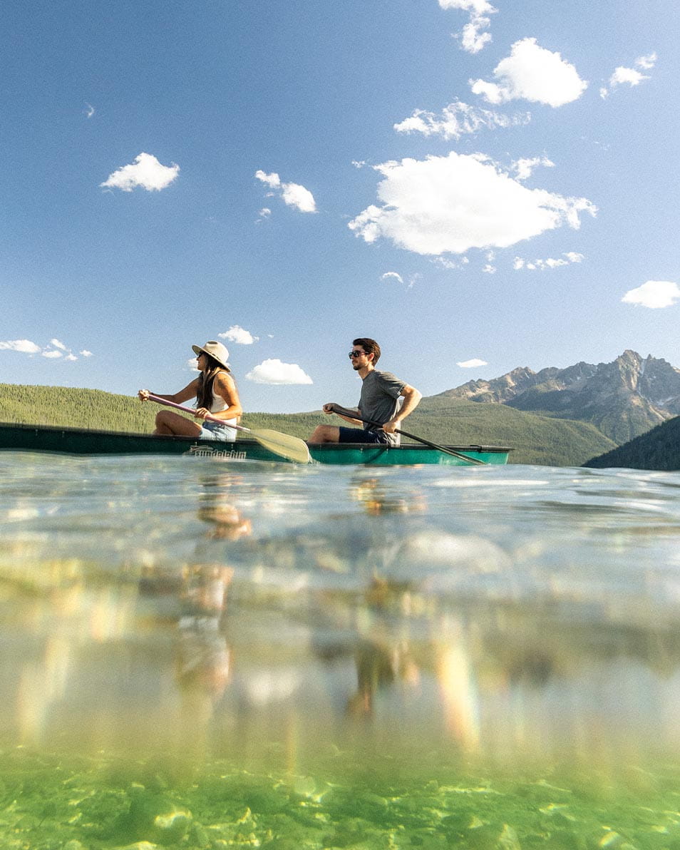 Couple canoeing on lake
