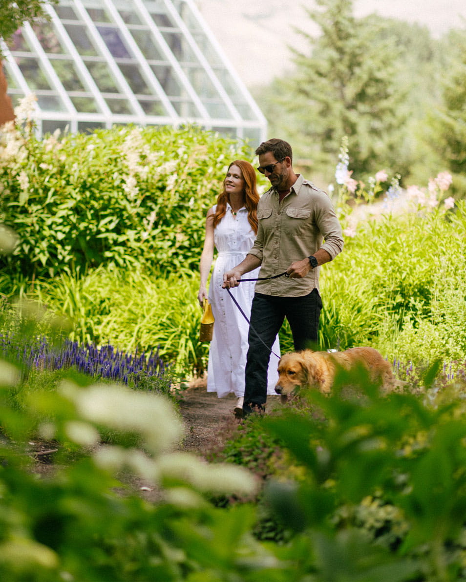 Couple and dog enjoying the Sawtooth Botanical Gardens in Ketchum, ID