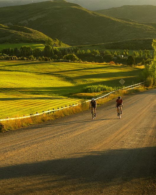 Two cyclists on the road near Snowmass