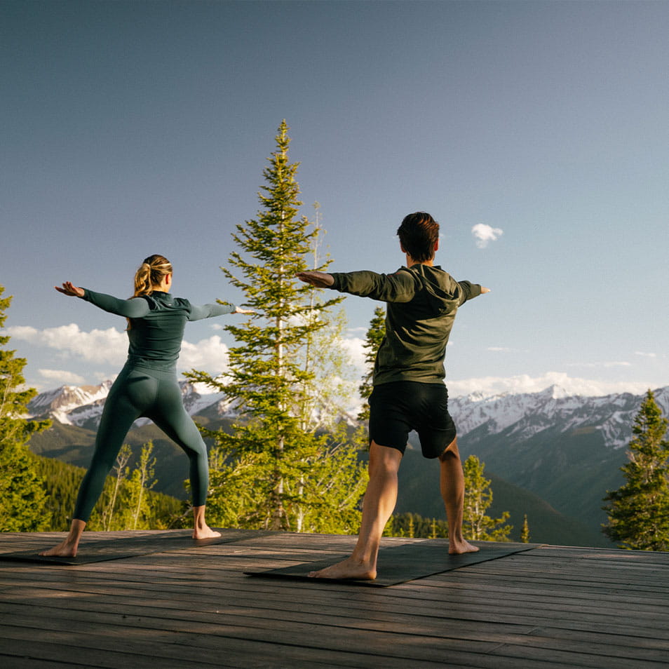 Couple doing yoga on Aspen Mountain