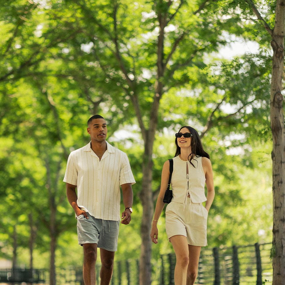 Couple walking through park
