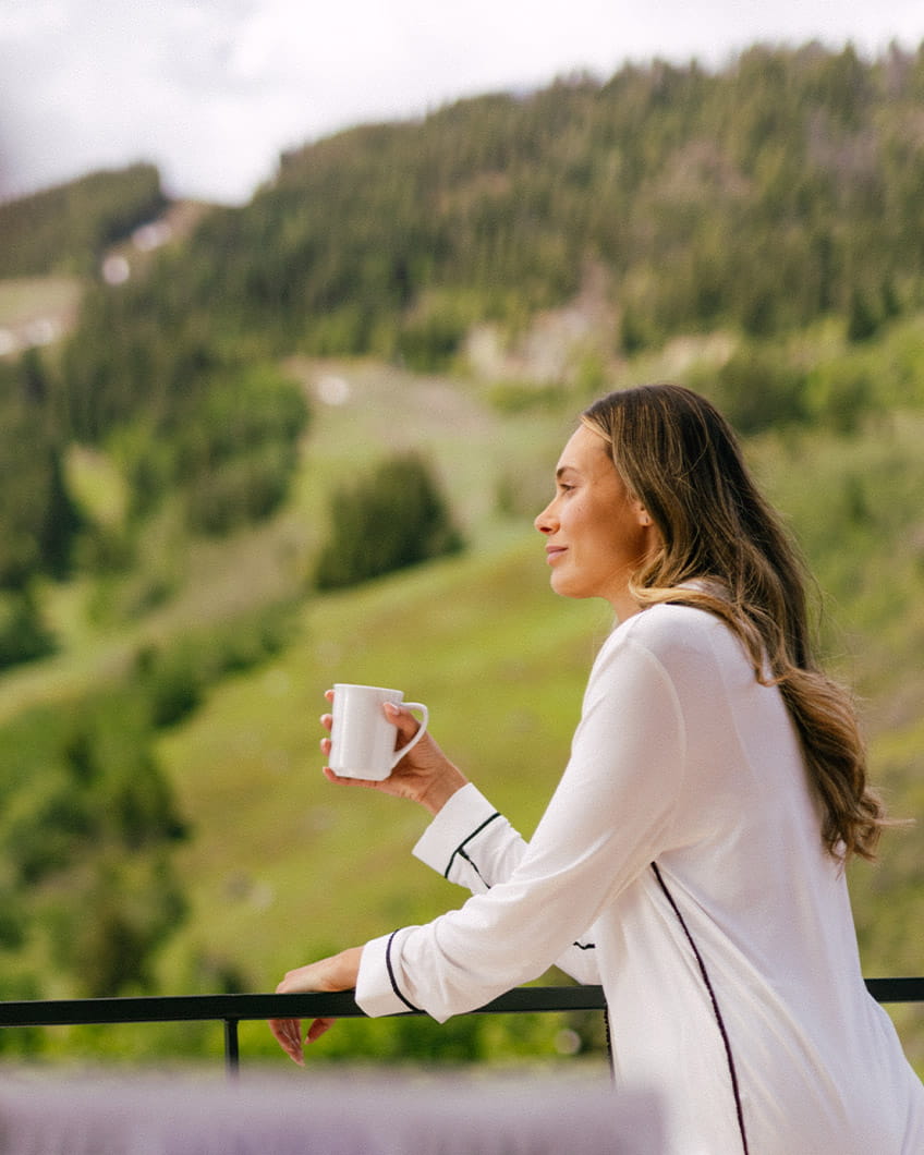 Girl drinking coffee on terrace