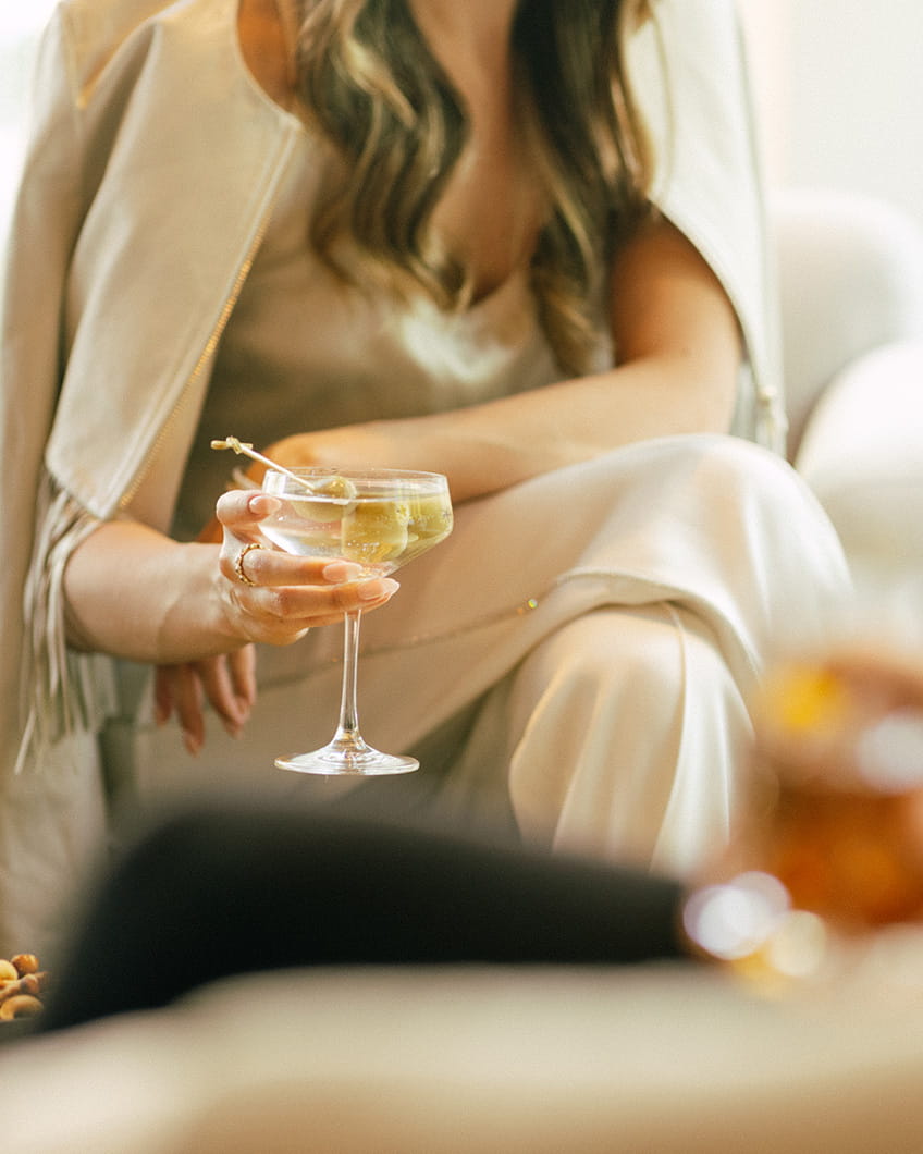 Woman drinking martini