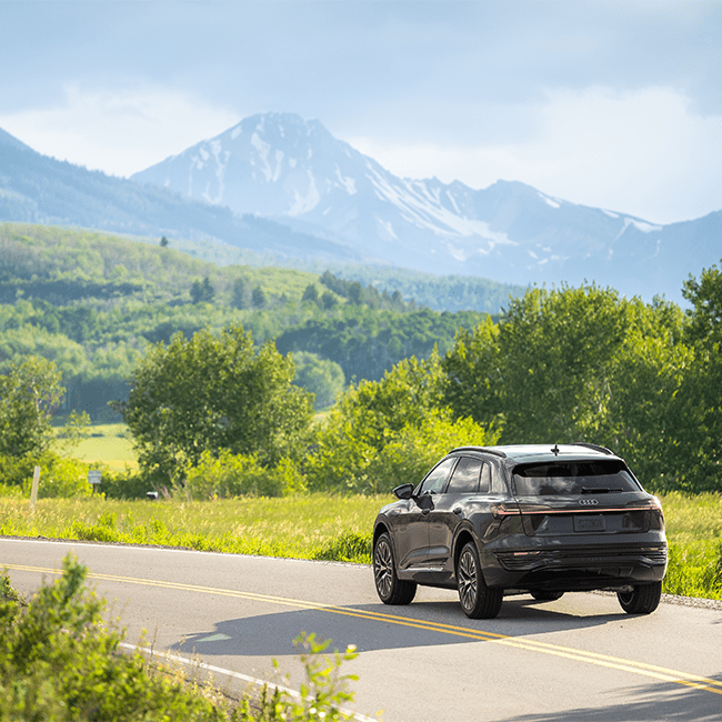 20204 Audi drives on paved road in Aspen Snowmass, on an overcast summer day