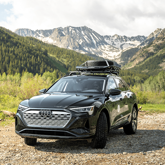 2024 Audi parked in front of summer mountain range, with Limelight Ketchum