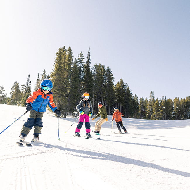 family skiing on mountain