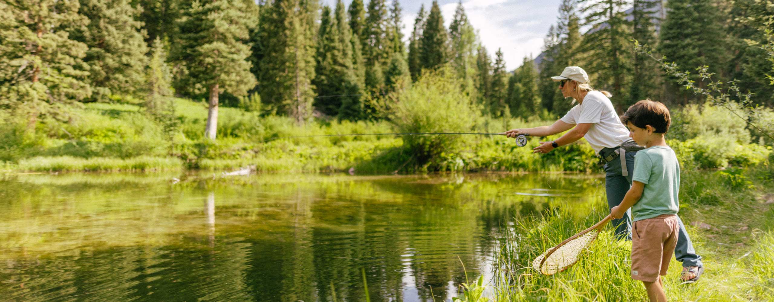 Boy fishing with guide in Aspen